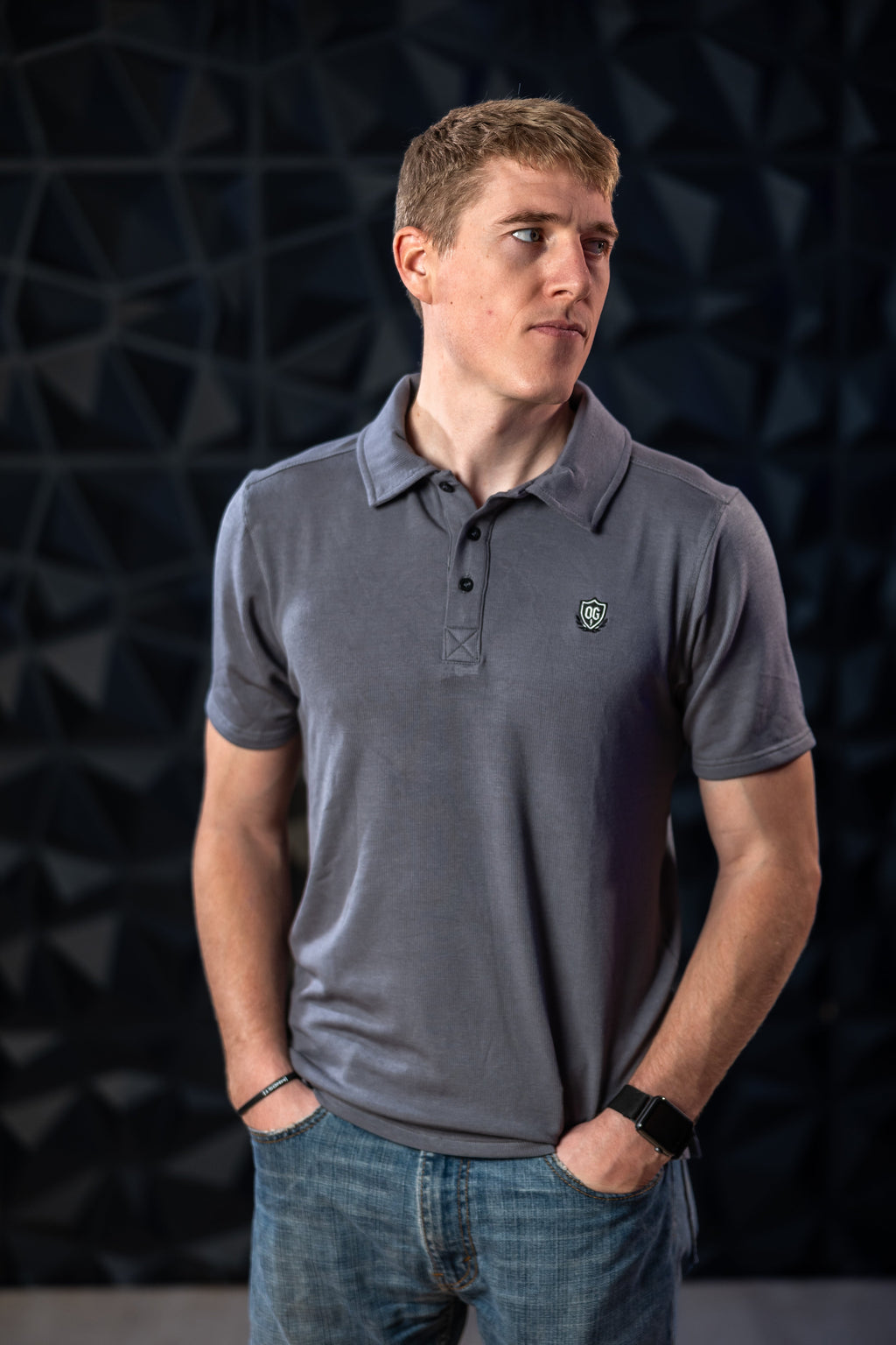 Man wearing grey EMF blocking polo shirt