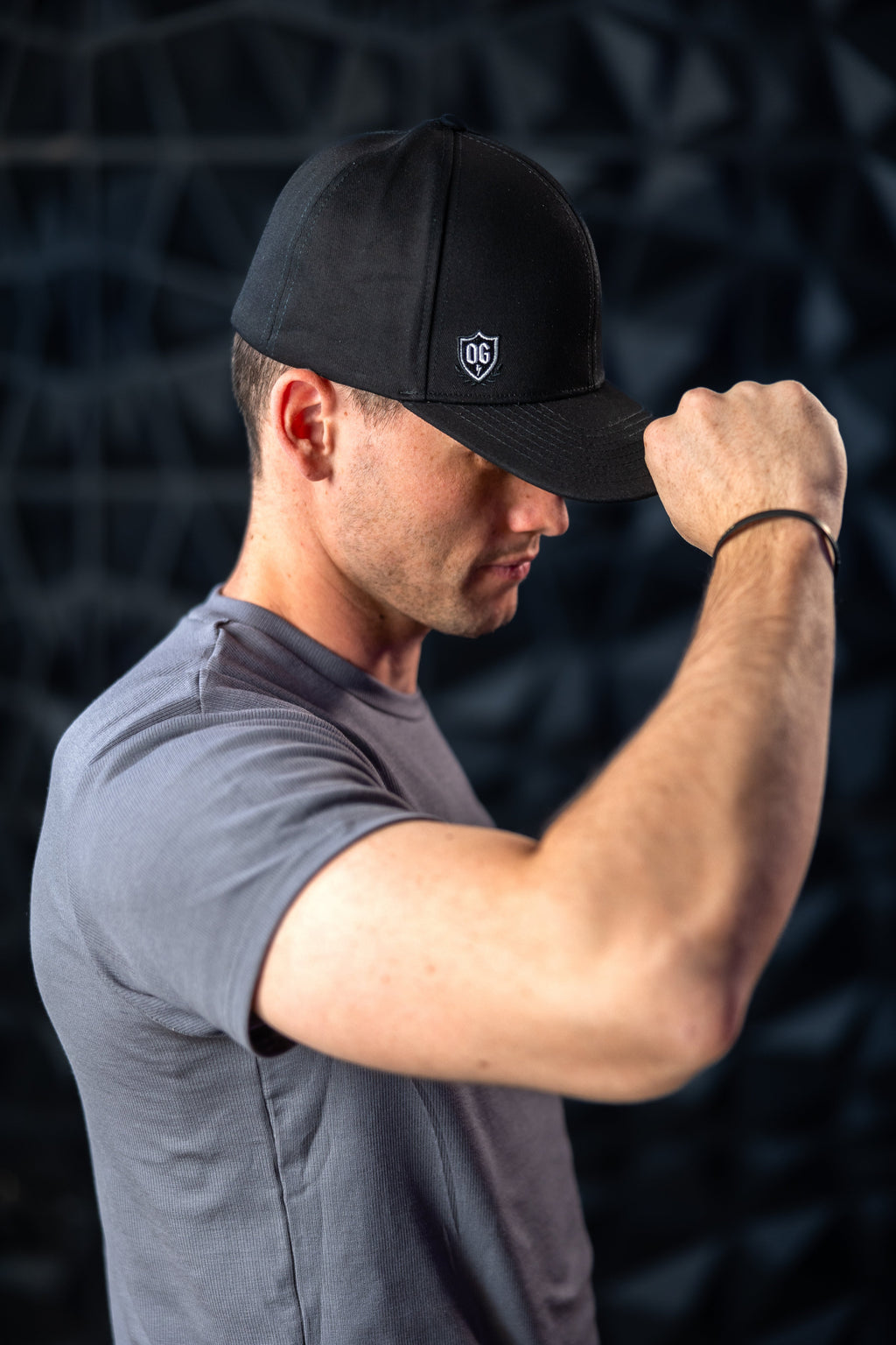 Man with black ball cap on head