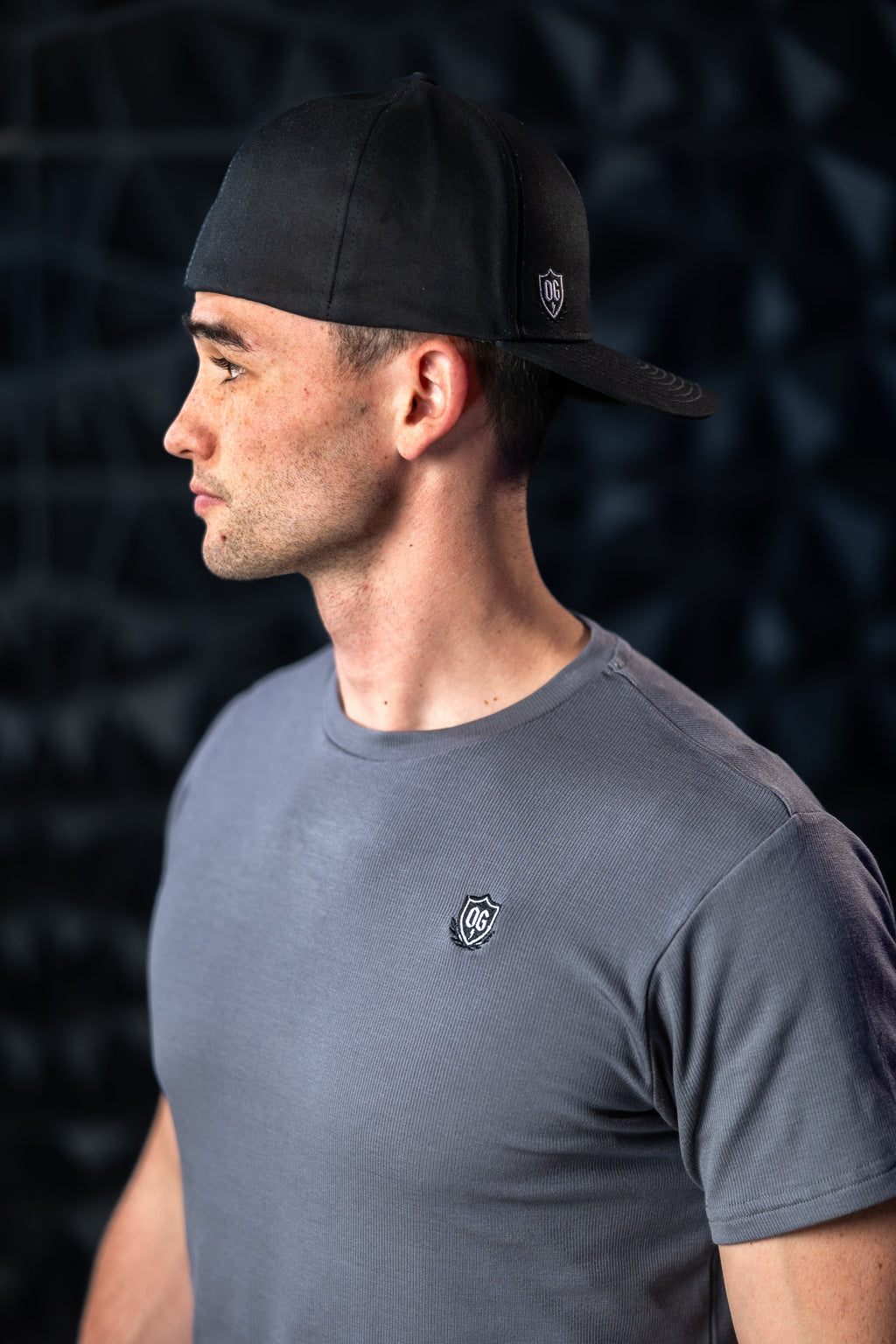 Man with black ball cap on head