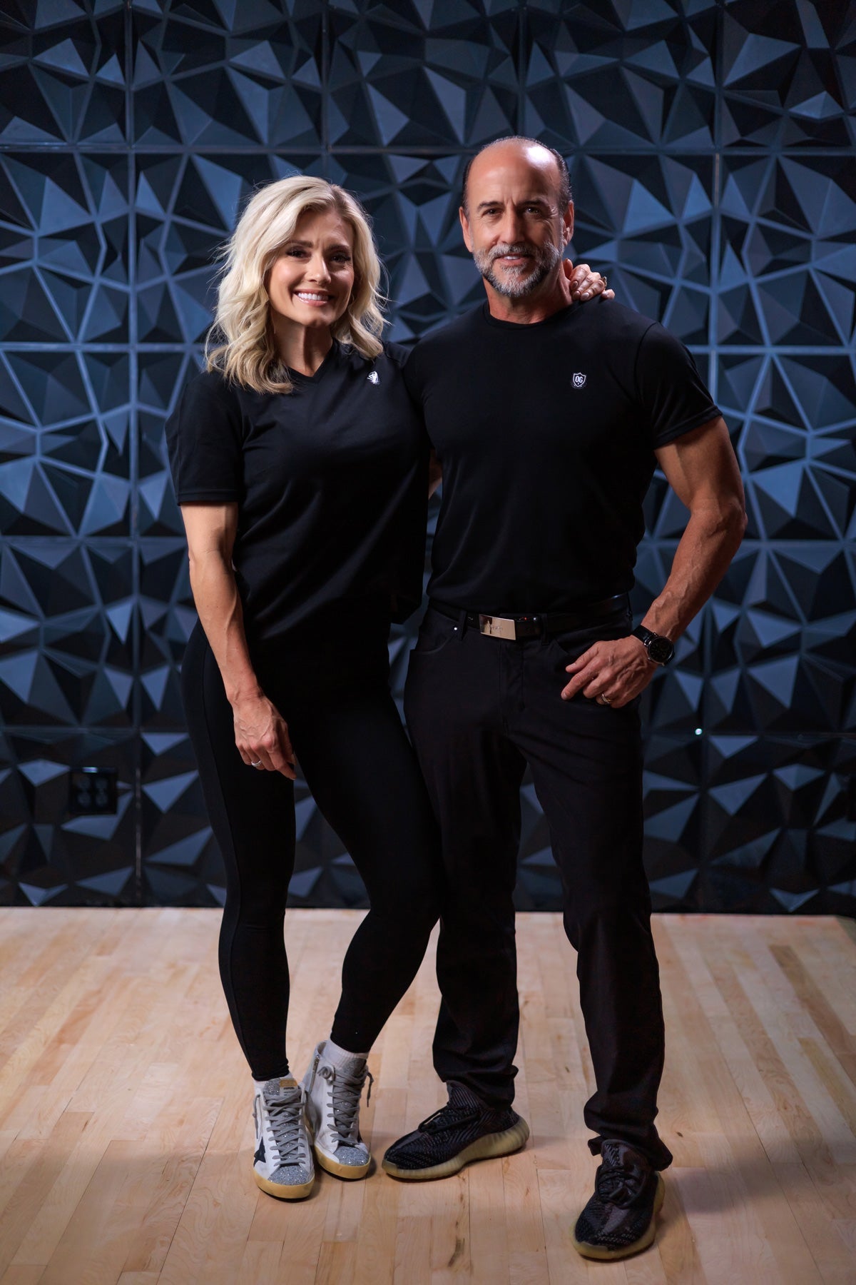 Man and woman wearing black EMF blocking t-shirt
