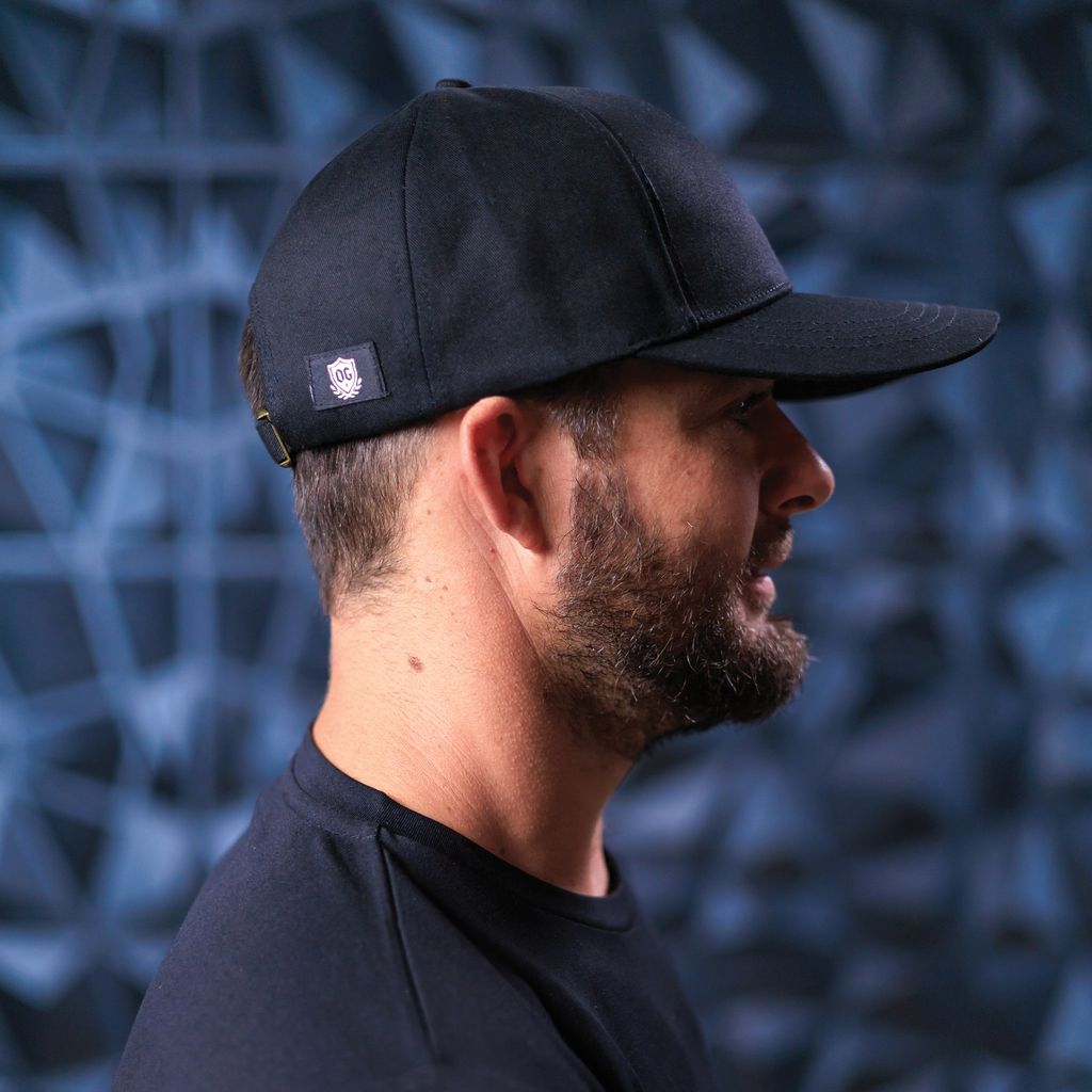 Man with black ball cap on head